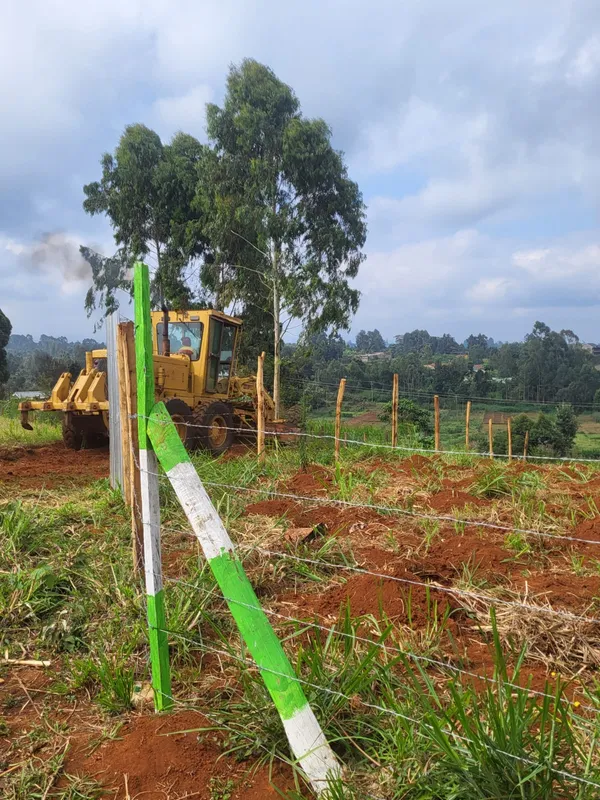 Fenced Plot of Land with Red Soil