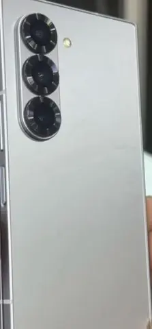 A phone , Sumsung Galaxy Z fold 8 Ai cell phone . Yellow apple