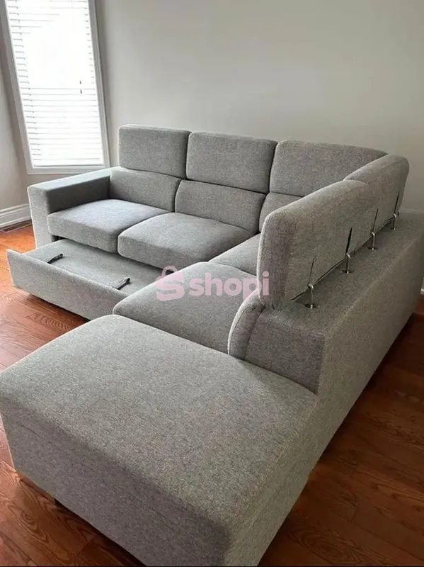 Grey L-Shaped Sectional Sofa with Pull-Out Bed and Adjustable Headrests