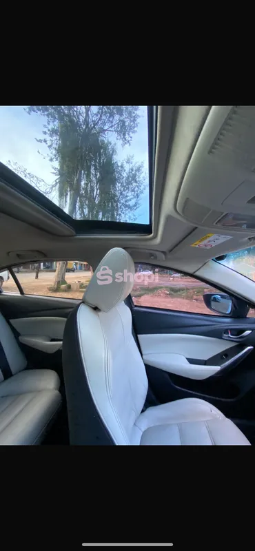 White Mazda Atenza Saloon