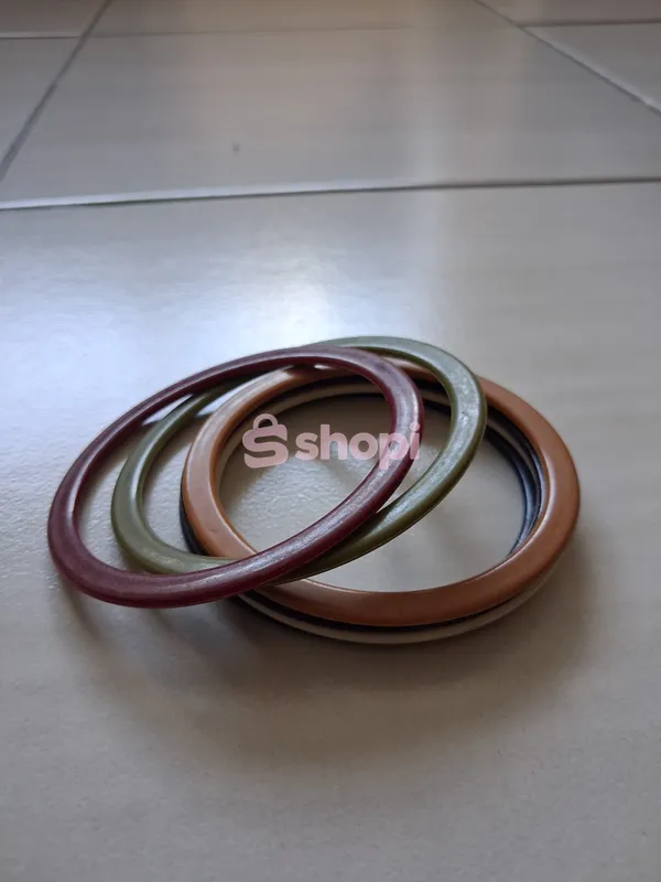 Set of resin bangle bracelets in red green and brown